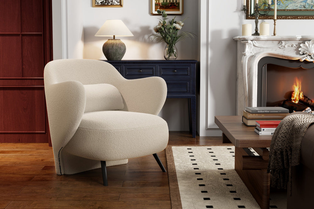 In a Living Room, There is Left-Side's Acute Angle Front View of A Luxurious, Cream, Hardwood Frame, Sleek Black Steel Legs, Erica Boucle Single Decorative Chair.